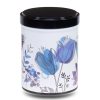 Artist's metal tea box illustrated with a design of blue flowers on a white background