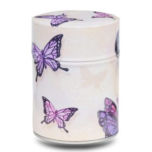 Metal tea caddy featuring a Japanese geisha with butterflies on a beige background