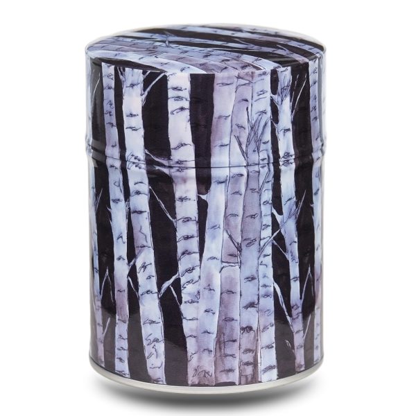 Metal tea caddy illustrated with a design of white beech trees on a black background