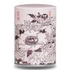 Boite à thé en métal illustrée d'un dessin de fleurs japonaises avec des caractères japonais sur fond rose/beige