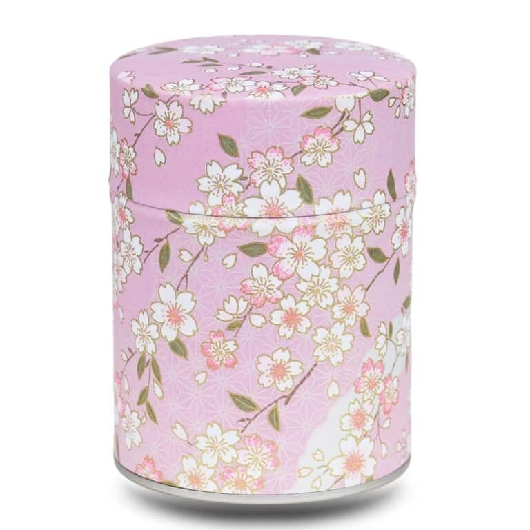 caja de té rosa malva con flores de cerezo blancas