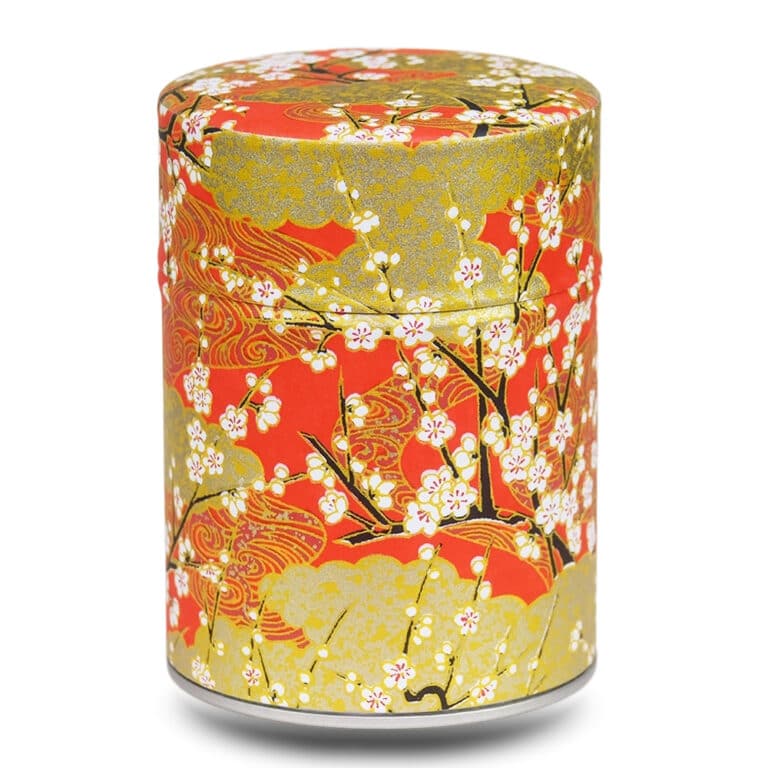 caja de té roja y dorada con flores de cerezo