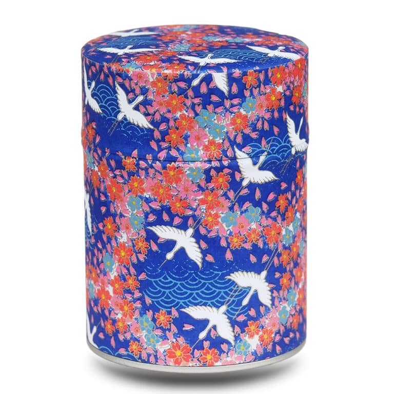 Blaue Teebox mit weißen Kranichen