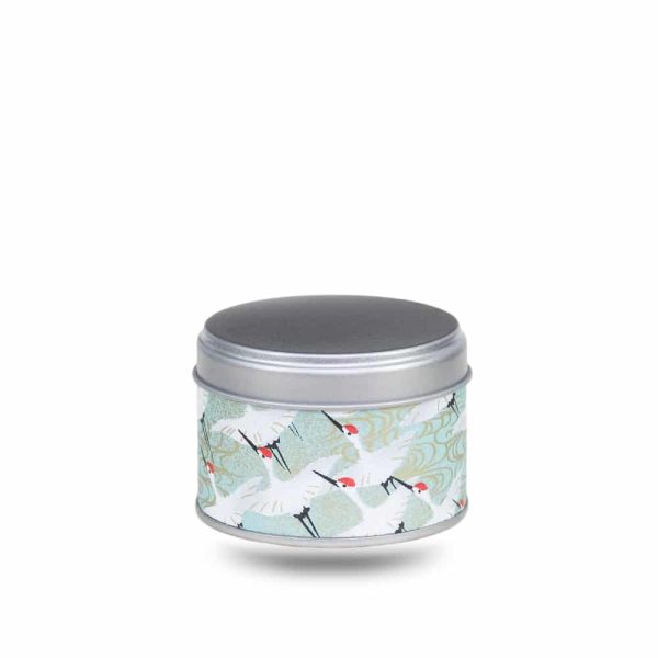 Small metal tea box covered in turquoise washi paper with white cranes