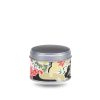 Small metal tea box covered with white, black and red washi paper with landscapes.