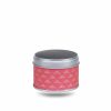 Small metal tea box covered in red washi paper with geometric gold motifs