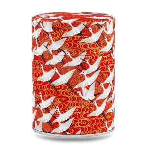 Boîte à thé artisanale Minabe 100 g, recouverte de papier washi rouge orné de grues blanches, couvercle assorti décoré.